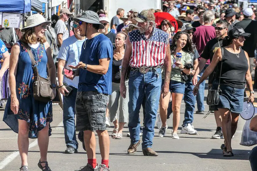 Crowd of people walking on a busy street